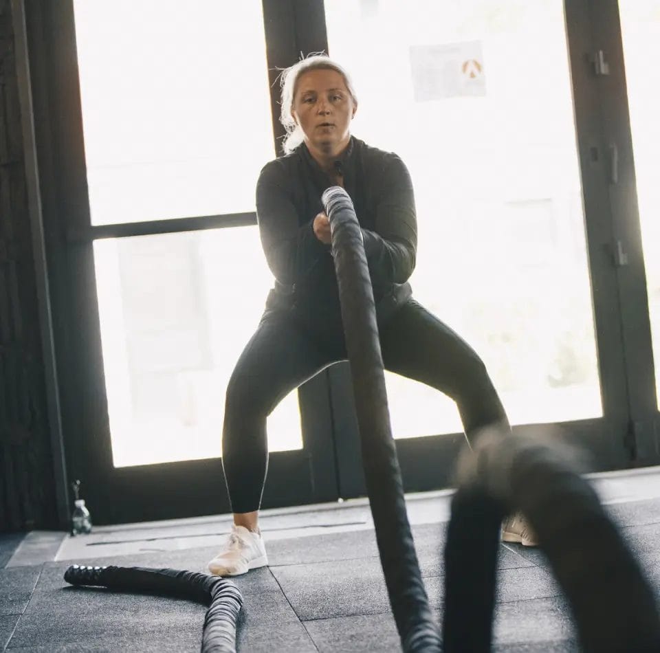 Undenied Fitness Woman Training with a Rope