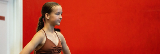 undenied fitness teen girl with red wall